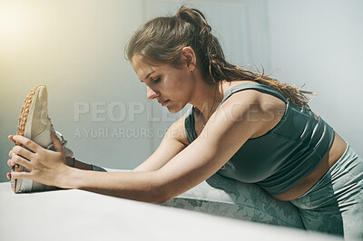 Buy stock photo Focused woman stretching feet for fitness training, outdoor performance and strong commitment. Calm female athlete warm up legs for sports workout, muscle mobility and flexible exercise for running