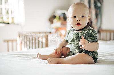 Buy stock photo Baby boy, bed and smile in home with excited face, attention and looking with health, youth and childhood. Young infant, bedroom and development in house, apartment and child wellness in morning