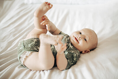 Buy stock photo Portrait, babies and cute with a boy on a bed in a bedroom of a home alone for child development. Kids, baby and adorable with a newborn infant in a house in the morning for growth or comfort