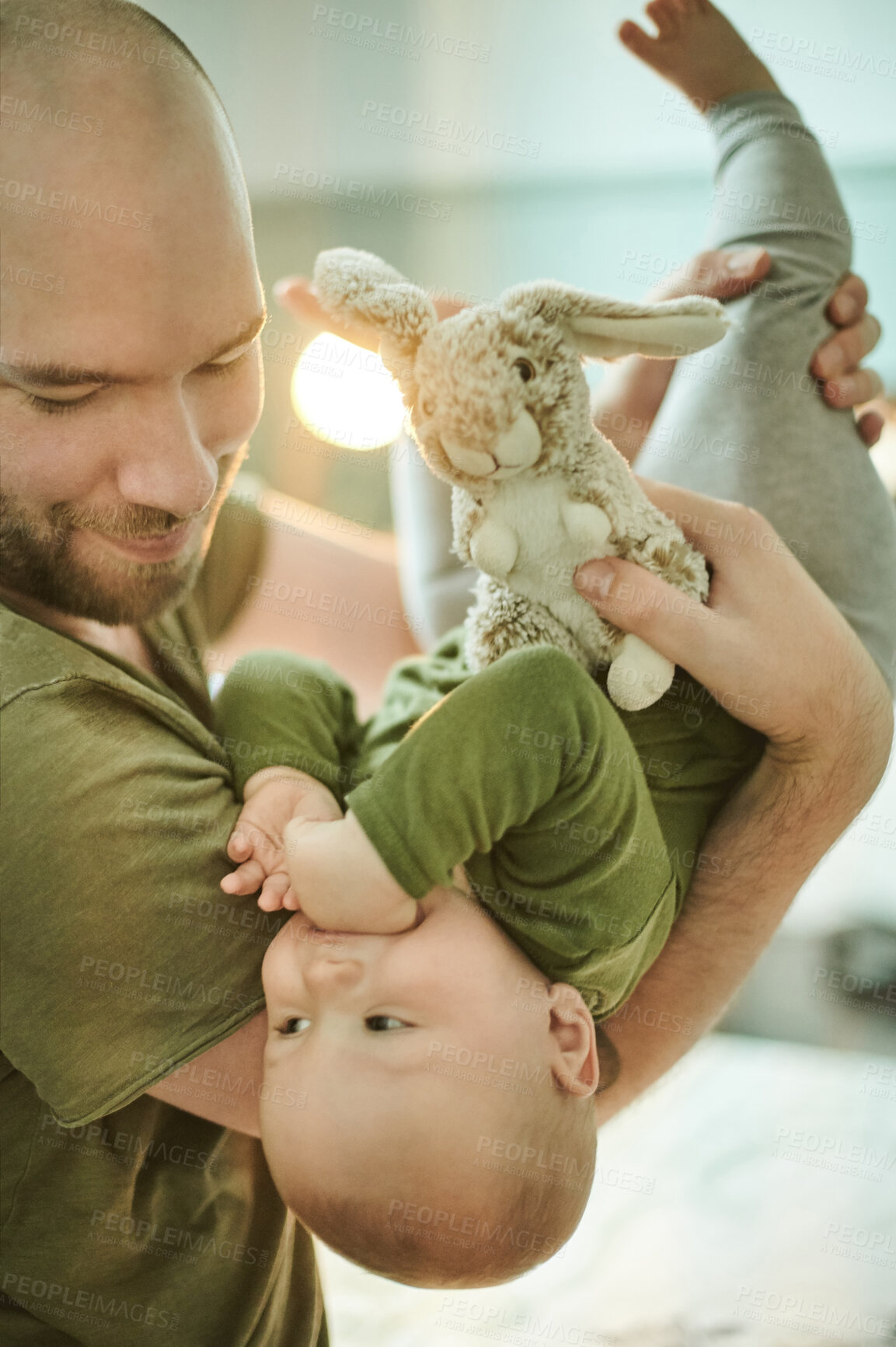 Buy stock photo Father, baby and bedroom for playing with toy, bunny and love for happiness, care and bonding in home. Happy dad, child and rabbit toys for kid, helping hand and together by bed in morning at house