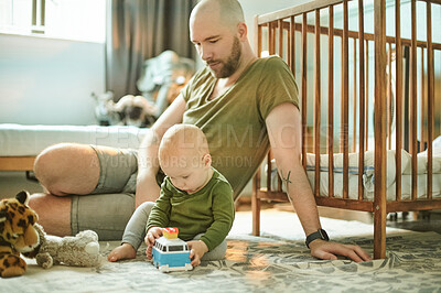 Buy stock photo Learning, playing and development, man and baby on nursery floor, new dad and infant bonding with toys in playroom. Family, love and young father with small child in bedroom with kids toy bus at home