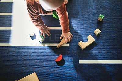 Buy stock photo Learning, toys and building blocks with baby on floor of living room for child development, education and health of top view. Curious, innocence and playing with kid at home for mobility games