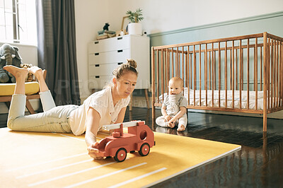 Buy stock photo Bonding, playing and mother and child with a toy for education, curiosity and learning. Family, game and a woman with a baby and truck for play time, mental development and toys for fun at home