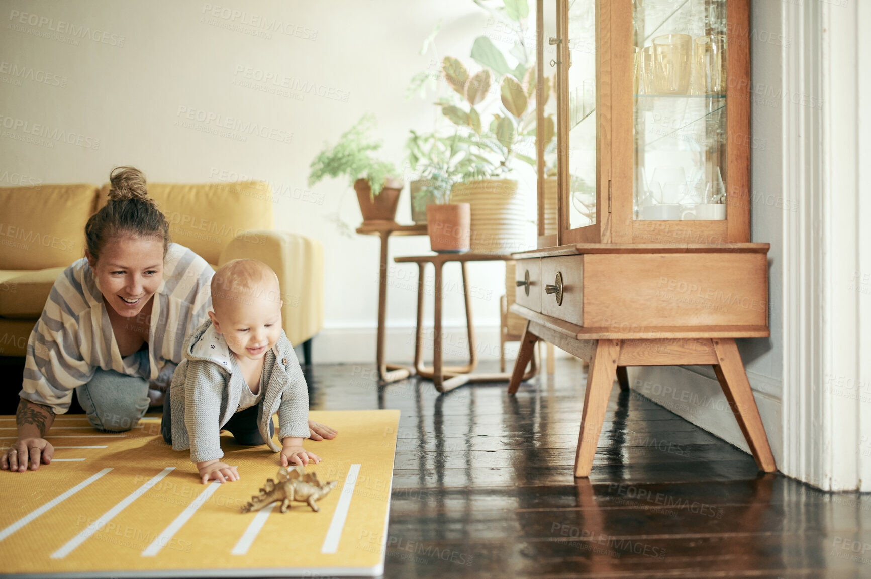 Buy stock photo Baby, toy and mom playing with newborn on the floor of a house or home and bonding together. Care, motherhood and single parent or woman having fun with infant, child or kid with happiness