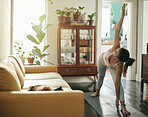 Yoga stretching, home training and woman doing body warm up, pilates or workout for healthcare, wellness or self care. Exercise person, health lifestyle and female yogi fitness in house living room