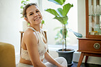 Yoga, portrait and happy woman at home doing warm up and pilates training with a smile. Wellness, fitness and exercise of a relax young person in house with spiritual practice for workout and health
