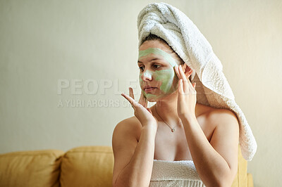 Buy stock photo Facial, mockup and woman applying beauty product on her face for treatment, skincare and self care in a home or house. Detox, mask and female cleaning her skin for morning routine while she relax