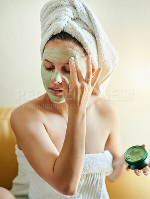 Buy stock photo Facial, beauty and woman using cosmetic product on her face for skincare and self care in her home or house. Detox, mask and female cleaning her skin for morning routine while she relax