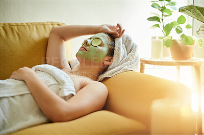 Buy stock photo Spa, facial and woman with cucumber on eyes or face for vitamin c, wellness and natural beauty lying on a couch or sofa. Relax, treatment and skincare of happy female using vegetable to detox