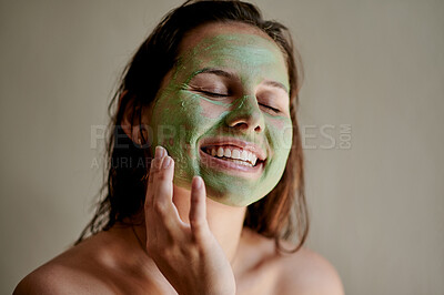 Buy stock photo Facial mask, beauty and happy woman using cosmetic product on her face for treatment, skincare and self care in studio. Detox, spa and female cleaning her skin for morning routine while she relax