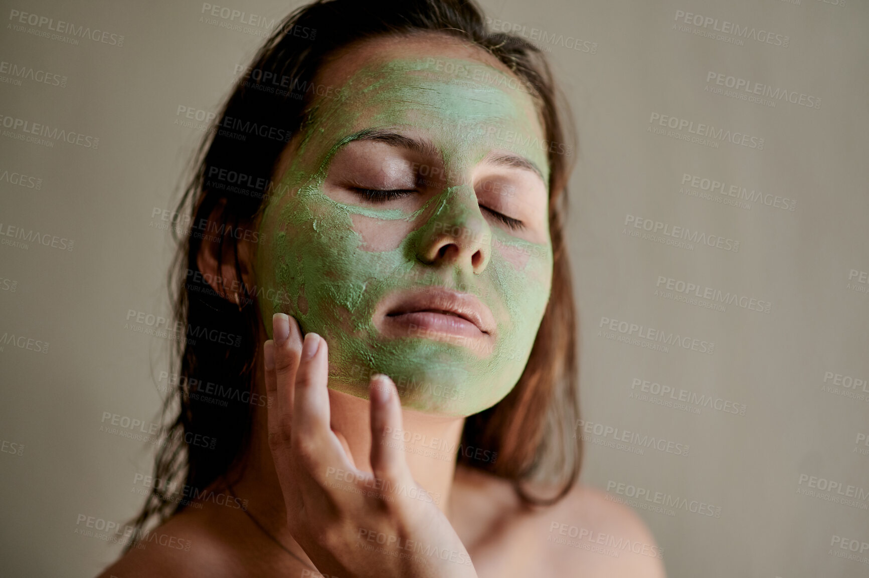 Buy stock photo Facial mask, treatment and woman using beauty product on her face for cosmetics, skincare and self care in her home or house. Detox by female cleaning her skin for morning routine while she relax