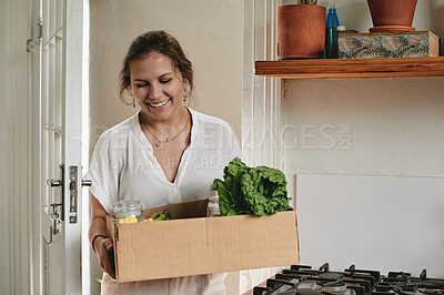 Buy stock photo Woman, kitchen and vegetables in box, home and food for nutrition on discount with dinner preparation. Female chef, smile and happy with grocery package for meal, recipe and heat for healthy lunch