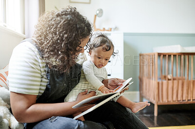 Buy stock photo Family, child development or book with a mother and baby reading a book in a home bedroom together. Children, babies and a woman storytelling to her adorable toddler while bonding in their house