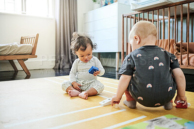 Buy stock photo Babies playing, game and kid toys for mobility development and learning together in a home bedroom. Nursery, toy brick and cute children with block play thing and activity in a house on the floor