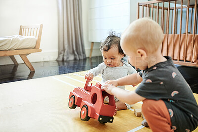 Buy stock photo Baby toys, home and toy car for mobility development and learning together in a bedroom. Nursery game, kids and cute children curious about play thing and babies activity in a house on the floor