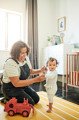 Buy stock photo Mother, family and baby with toys in bedroom for development, growth and bonding. Woman and child together for support, walking and help while learning or playing for fun with a smile and happiness
