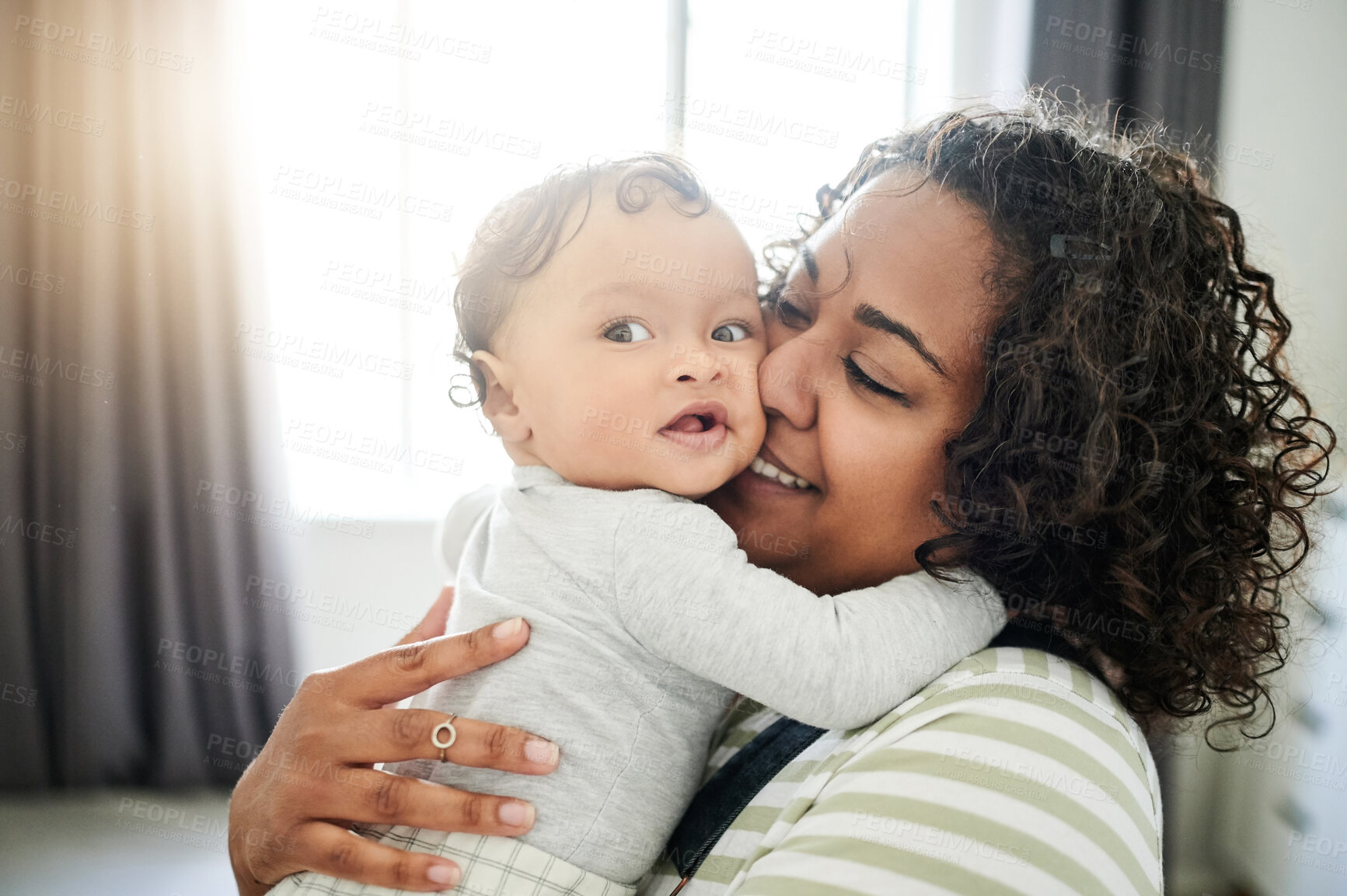 Buy stock photo Love, kiss and mom with her baby in his nursery playing, bonding and spending quality time. Maternal, happiness and young woman holding her infant boy child with a smile in bedroom at their home.
