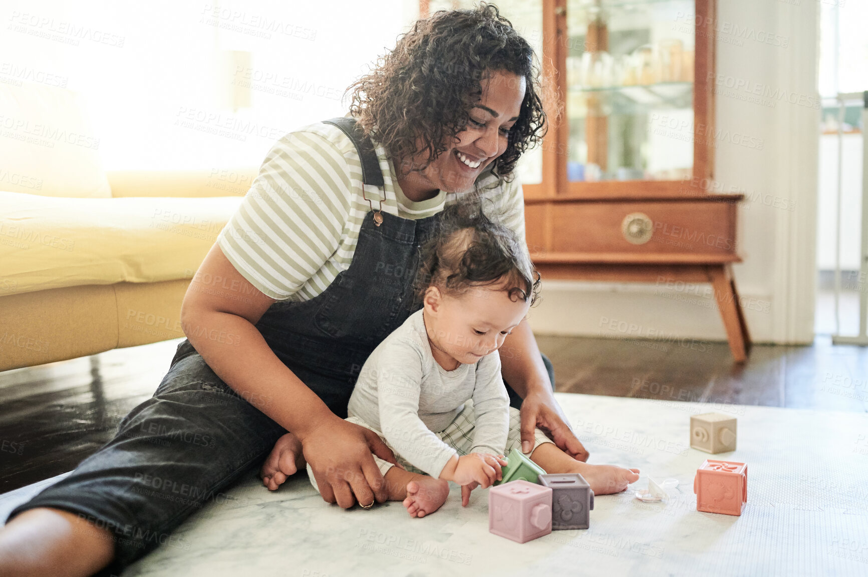 Buy stock photo Babysitter, baby and play with blocks in home, learning and education in house. Development, care and happy nanny playing with child toys, toddler and newborn while bonding and having fun together.