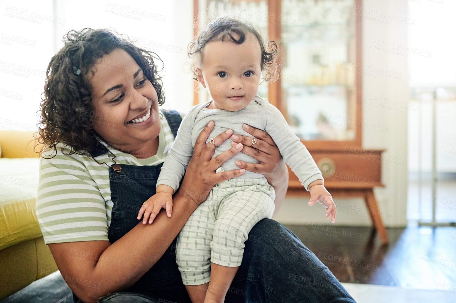 Buy stock photo Happy, family and mother holding baby in living room for motherhood, happiness and loving relationship. Love, home and portrait of child and mom for bonding, quality time and relax together on floor