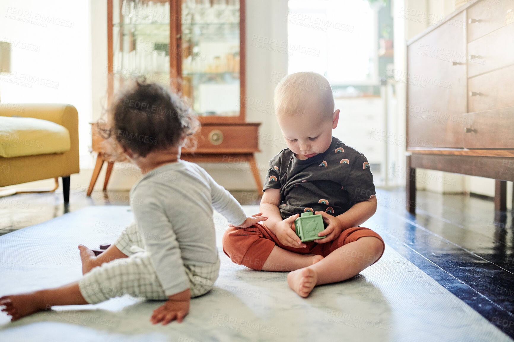 Buy stock photo Baby block, home and kid toys for mobility development and learning together in a bedroom. Nursery, toy brick and cute children curious about play building and youth activity in a house on the floor