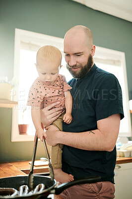 Buy stock photo Cooking, kitchen and a father at home with his baby in the morning together for food or lunch preparation. Family, children or kids with a man and infant boy in a house to make a meal while bonding