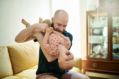 Buy stock photo Love, father and kid upside down, playing and bonding at home, cheerful and happiness. Family, male parent and happy dad with child, young person and laughing in the living room, flipping and loving