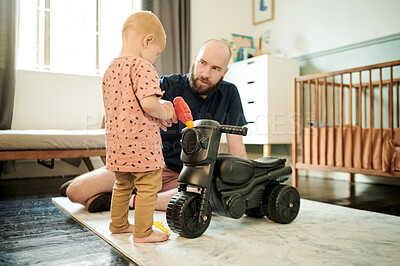 Buy stock photo Dad, baby and living room walking for motor skills, learning and growth in a home. House, family and young kid with father playing with toy car with love, parent support and care for toddler