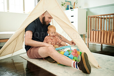 Buy stock photo Father, baby and play with balls in tent at home, having fun and bonding together. Child, care and dad playing with toys in bag with infant, toddler or kid enjoying quality family time in house.