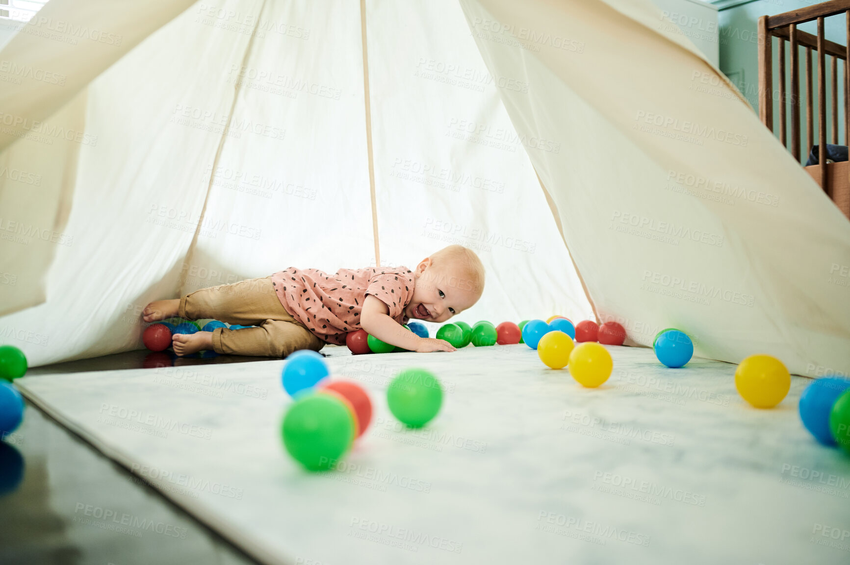 Buy stock photo Boy, child laughing and playing with toys in home bedroom with a tent for fun and growth development. Male toddler or kid with color balls for learning, education or game for happiness and creativity