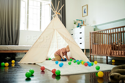 Buy stock photo Baby, child and playing in tent with toys in home bedroom for fun and growth development. Happy male toddler kid with color balls for learning, education game or happiness and creativity on nursery