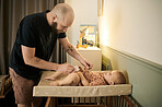 Baby, cleaning and a father changing a diaper in the nursery of his home as a single parent of a child. Family, kids and a man with his infant child to change a nappy for hygiene or care in a house