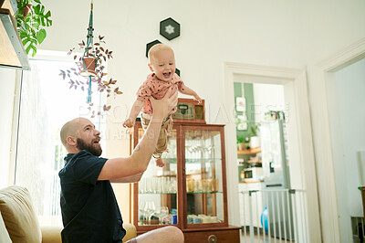 Buy stock photo Baby, father and lifting child plane in air on the sofa in a family home living room for fun. Male person or dad with a toddler kid for quality time, love and happiness while playing game together