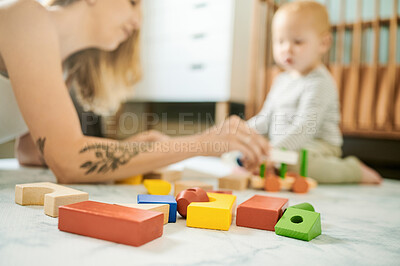 Buy stock photo Baby toys, building blocks and mother playing with a child in a family home bedroom for fun. Woman or mom with toddler child together for quality time, learning and mobility or growth development