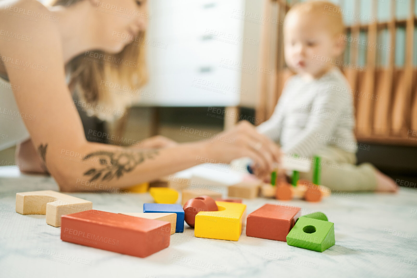 Buy stock photo Baby toys, building blocks and mother playing with a child in a family home bedroom for fun. Woman or mom with toddler child together for quality time, learning and mobility or growth development