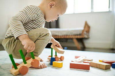 Buy stock photo Child, playing and baby building blocks in home bedroom for fun and growth development. Male toddler kid with wooden car toys for learning, education or game for creativity and motor skills