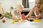 Playing, baby toys and learning with blocks and a mother and child in family home bedroom for fun. Woman or mom with toddler kid together for quality time, building and mobility or growth development