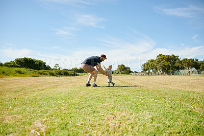 Buy stock photo Family, happy and baby play with father in field for bonding, quality time and adventure in countryside. Childhood, love and boy with dad outdoors on holiday, summer vacation and weekend in nature