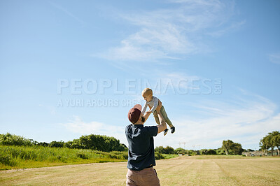 Buy stock photo Happy family, park and father lifting baby in field for bonding, quality time and adventure in nature. Childhood, love and dad carrying child playing outdoors on holiday, summer vacation and weekend