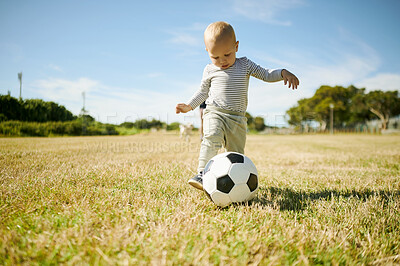 Buy stock photo Park, sports and baby with soccer ball in field for playing, having fun and adventure in nature. Childhood, fitness and happy boy outdoors for football games on holiday, summer vacation and weekend