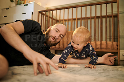Buy stock photo Family, children and a father playing with his baby son in the bedroom using a hand puppet for bonding. Kids, love and a young man having fun together with his infant child on the floor of their home