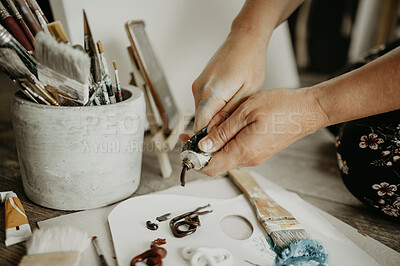 Buy stock photo Hands, paint in tube and creative person in studio, art and watercolor supplies with equipment and closeup. Artist talent, painter in workshop and artist, tools for creativity and painting process