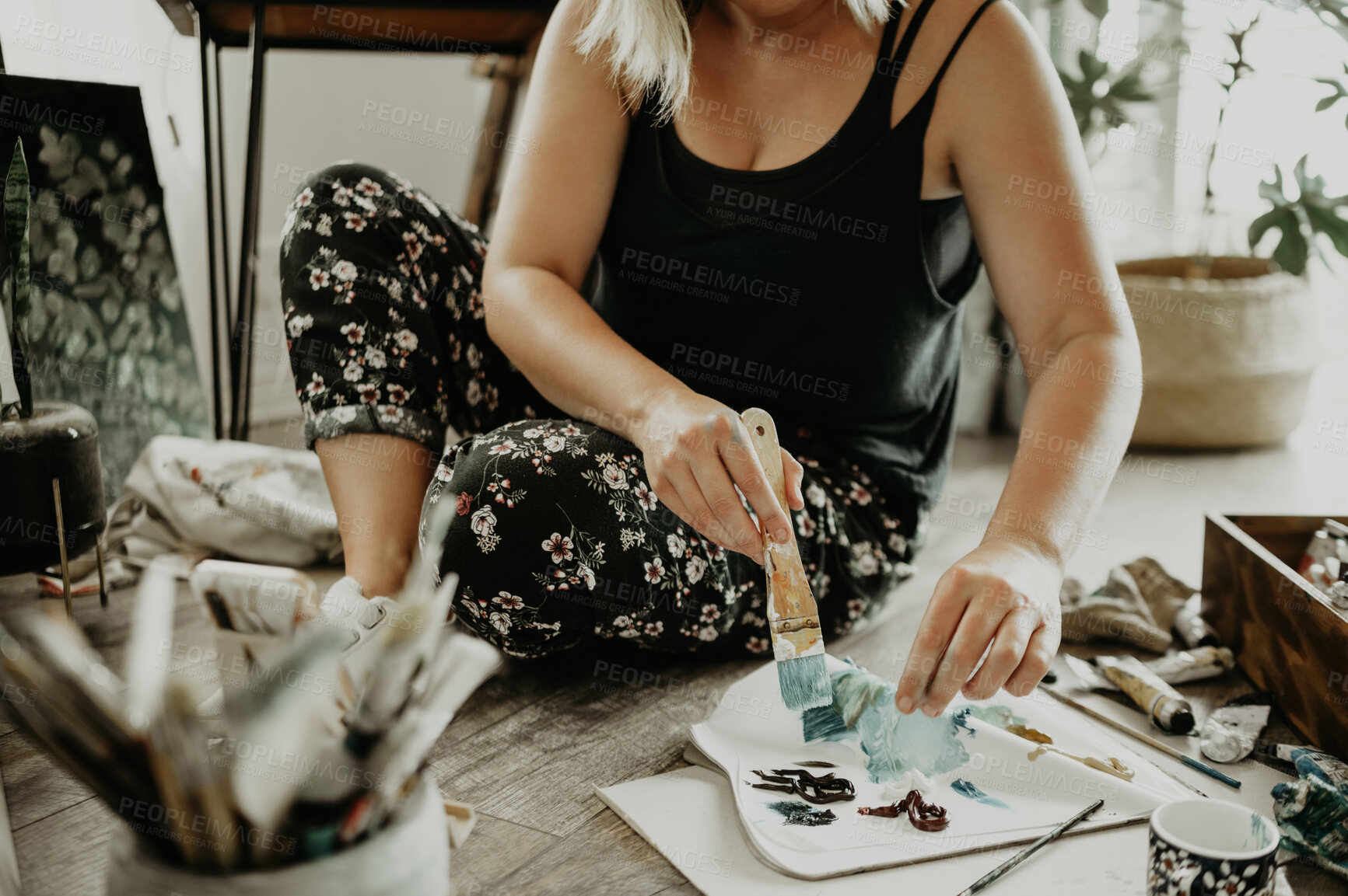 Buy stock photo Paint, brush and oil with woman on floor with mixing for project in studio with inspiration and passion at house. Female artist, colour and palette in closeup at workshop for art with talent.