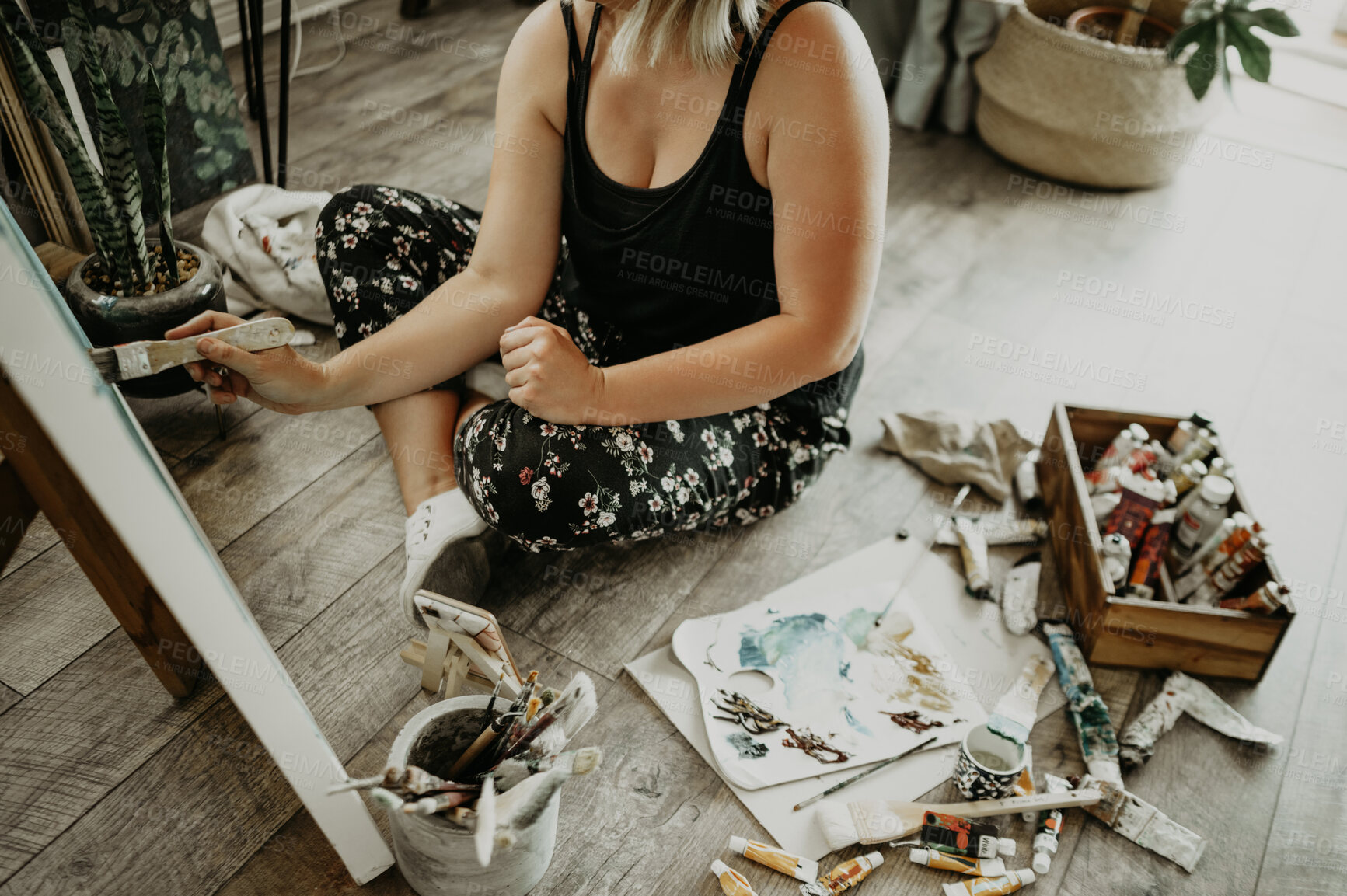 Buy stock photo Art, creativity and paint, woman on floor of studio at home with brush, canvas and inspiration with color from above. Painting tools, talent and artist with vision, freedom and creative work in house