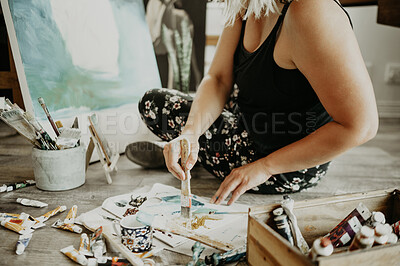 Buy stock photo Paint brush, creativity and art, woman in studio at home with skills, canvas and inspiration with color sitting on floor. Painting, tools and talent, artist with vision and freedom for creative work.