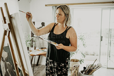 Buy stock photo Art, canvas and painting, woman in studio at home with brush, creativity and inspiration with color in apartment. Paint, tools and talent, professional artist with vision and ideas for creative work.