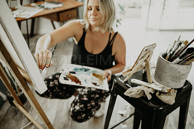 Buy stock photo Woman, painter in studio and painting with palette, canvas and creative person with talent. Creativity, art and female artist with brush and watercolor, easel and craft, concentration and inspiration