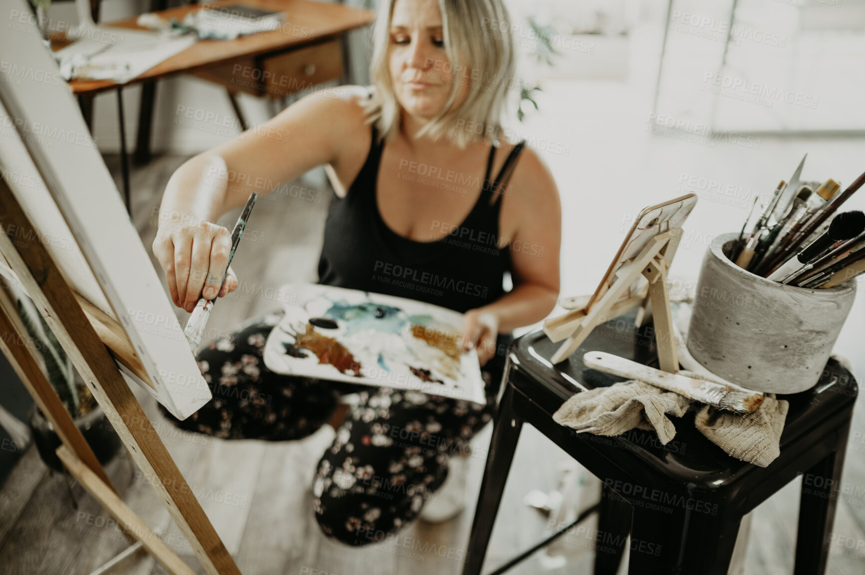 Buy stock photo Woman, painter in studio and painting with palette, canvas and creative person with talent. Creativity, art and female artist with brush and watercolor, easel and craft, concentration and inspiration