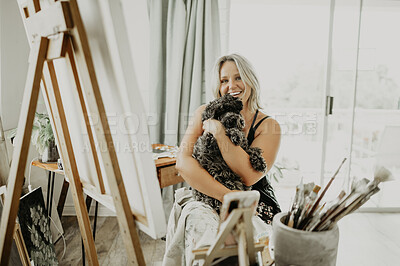 Buy stock photo Artist portrait, dog and happy woman hug animal for love, support and care in creative apartment, home studio or art workshop. Smile, creativity or relax designer, painter or person embrace furry pet