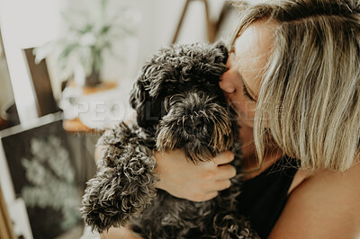 Buy stock photo Love, cuddle and a woman kissing her dog in a home studio or workshop for creative painting and art. Hug, puppy and painter with a female pet owner holding her cute animal companion in her house