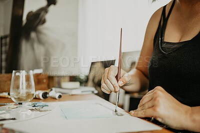 Buy stock photo Paint brush, paper and hands of person painting creative design, home artwork or picture inspiration in house studio. Artistic, table and closeup artist, painter or designer drawing, create or sketch